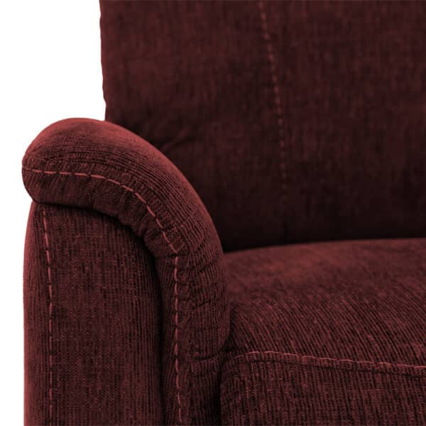 Close-up of a red upholstered Genesis LC-150 Lift Chair, highlighting its textured fabric, stitched seams, and plush rounded armrest for a comfortable design.